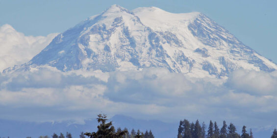 An image of the peak of Mt. Rainier covered in snow
